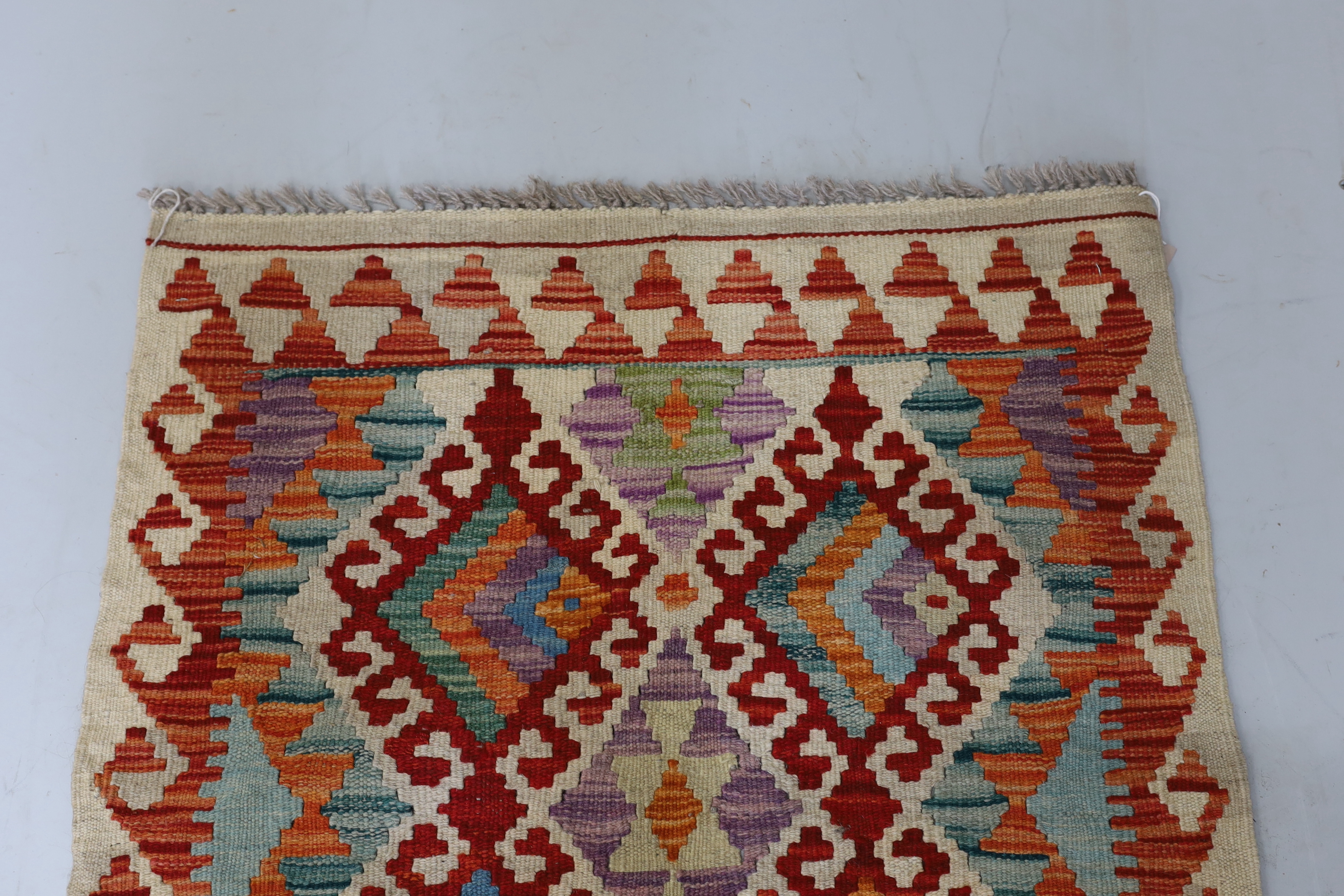 An Anatolian Kilim polychrome rug, 100 x 78cm